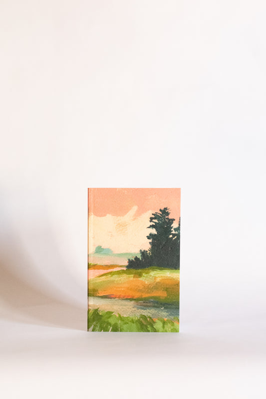 Notebook with a landscape illustration on a white background