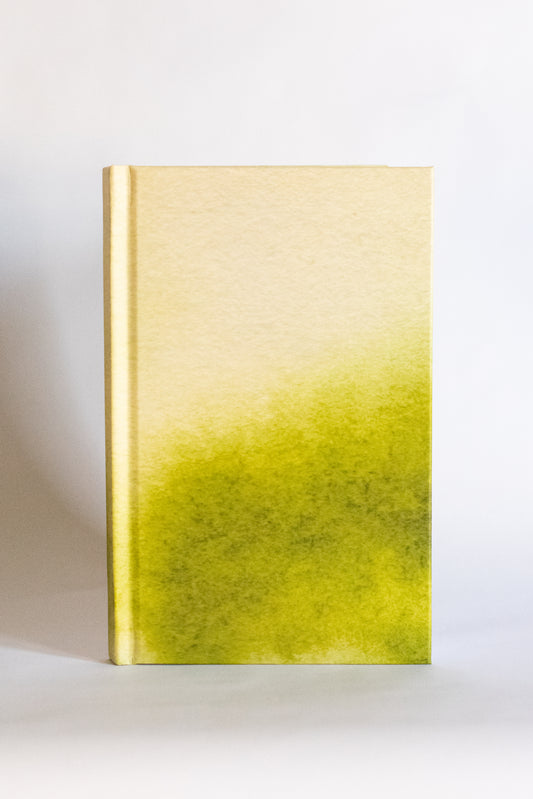 Gold and green gradient notebook on a white background
