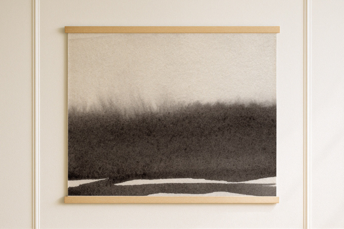 Abstract landscape tapestry in a wooden frame on a white wall